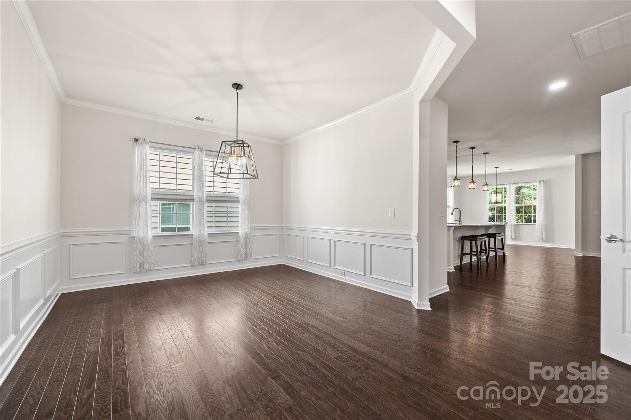 2337 Talon Point Circle Fort Mill, SC 29715 - Photo 9 of 48 a view of an empty room with wooden floor and a window