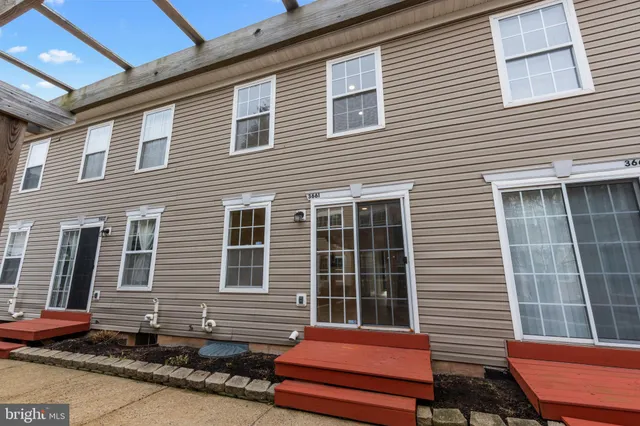 a view of a brick house with a large window