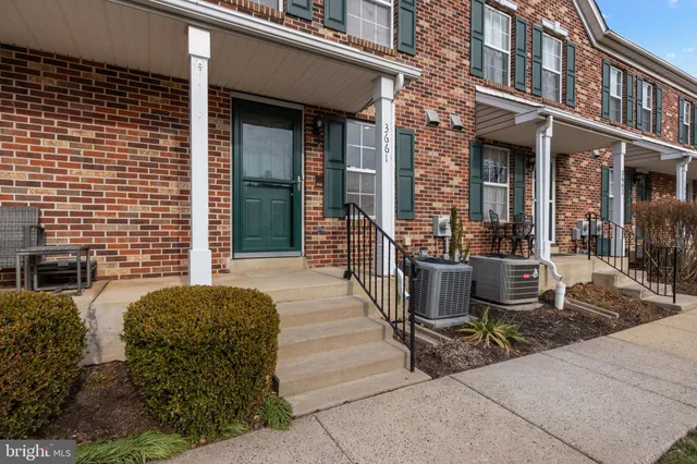 a view of a building with sitting area
