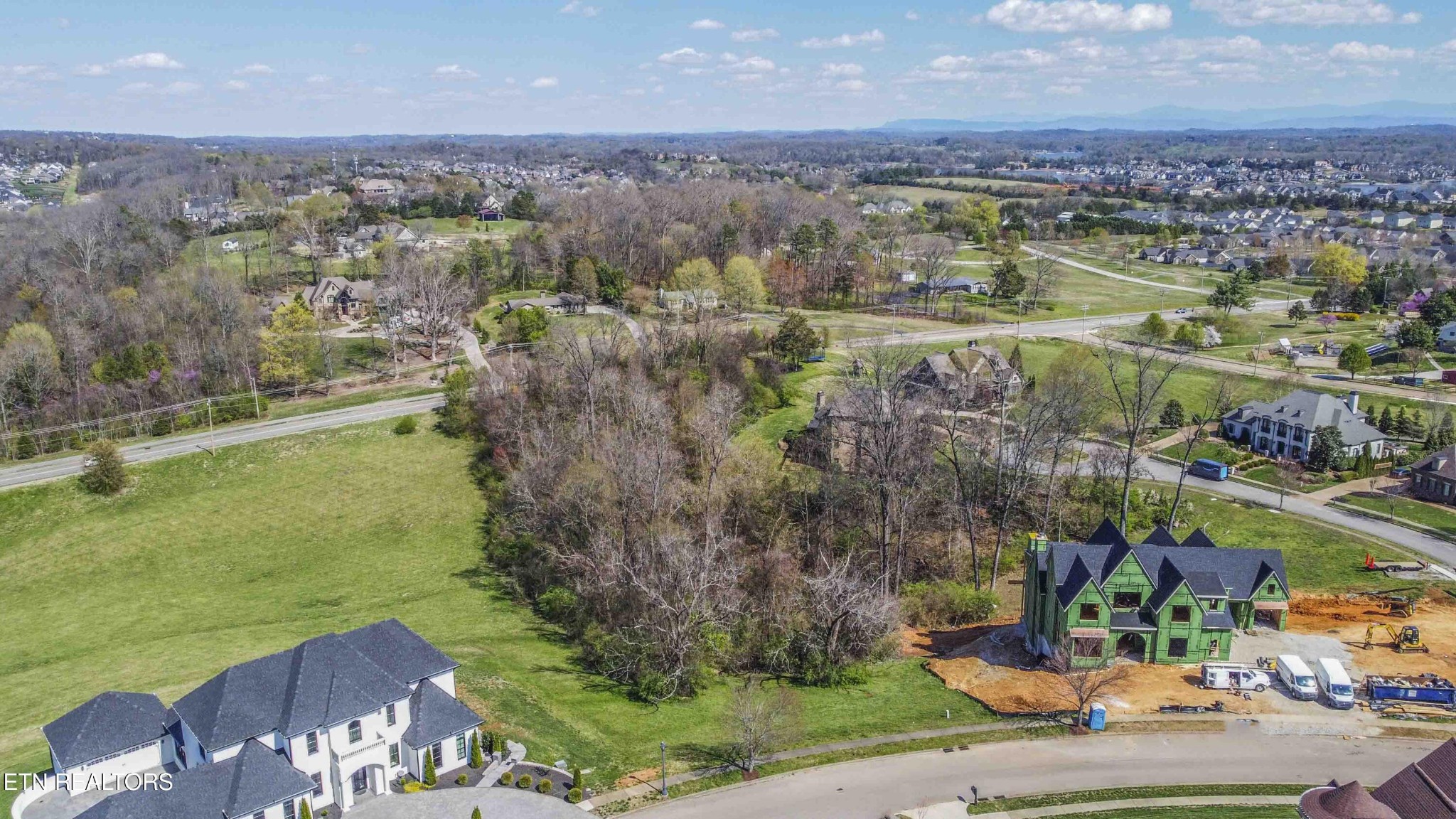 638 Barnsley Road Knoxville, TN 37934 - Photo 4 of 18 an aerial view of a city with lots of residential buildings ocean and mountain view in back