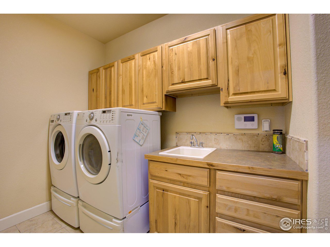 1515 Waterfront Drive Windsor, CO 80550 - Photo 12 of 40 The mudroom/laundry room is located right between the kitchen and the garage
