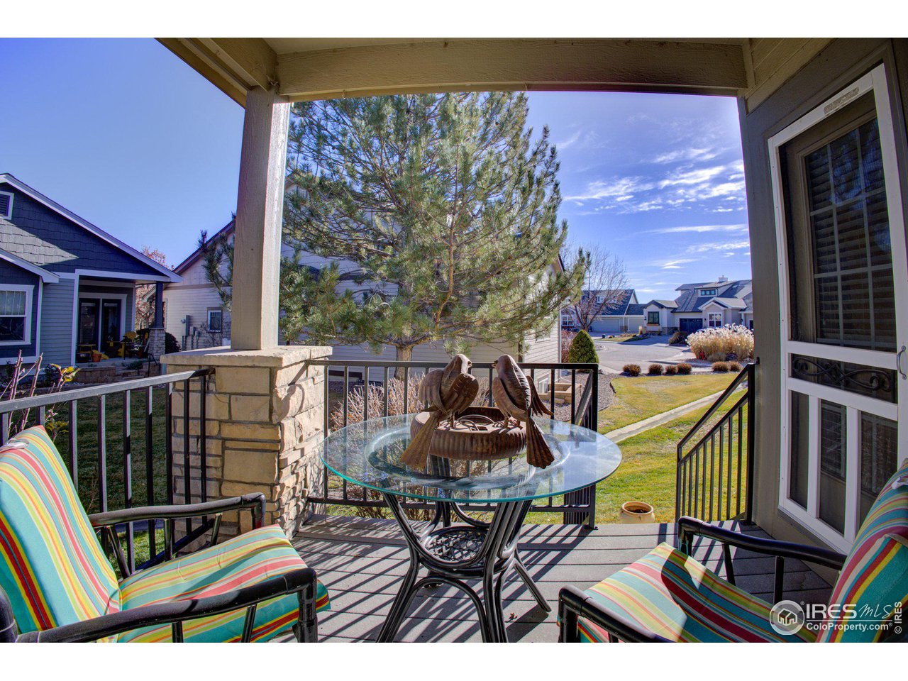 1515 Waterfront Drive Windsor, CO 80550 - Photo 32 of 40 You can get to the covered back deck from either the living room or the primary bedroom