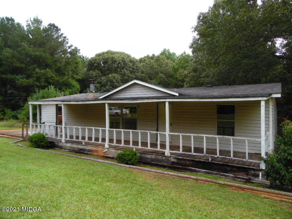 172 Sanders Road Jackson, GA 30233 - Photo 1 of 1 a front view of a house with garden