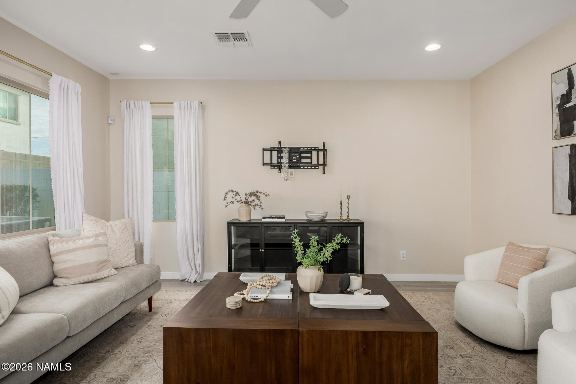 6413 North 17th Street Phoenix, AZ 85016 - Photo 4 of 26 a living room with furniture a couch and a potted plant