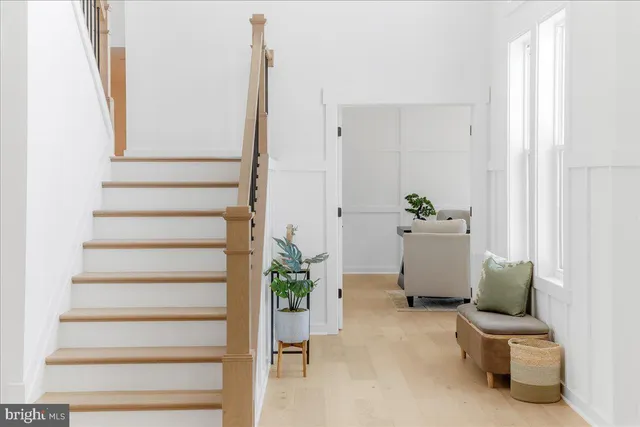 an aerial view of residential house with outdoor space and trees around