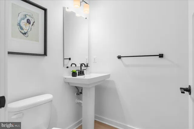 a aerial view of a house with a yard and lake view