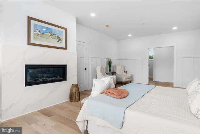 a front view of a house with a garden and yard