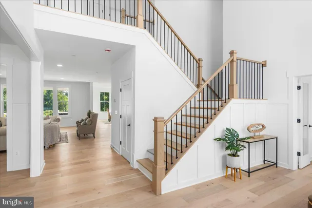 a living room with furniture and painting on the wall