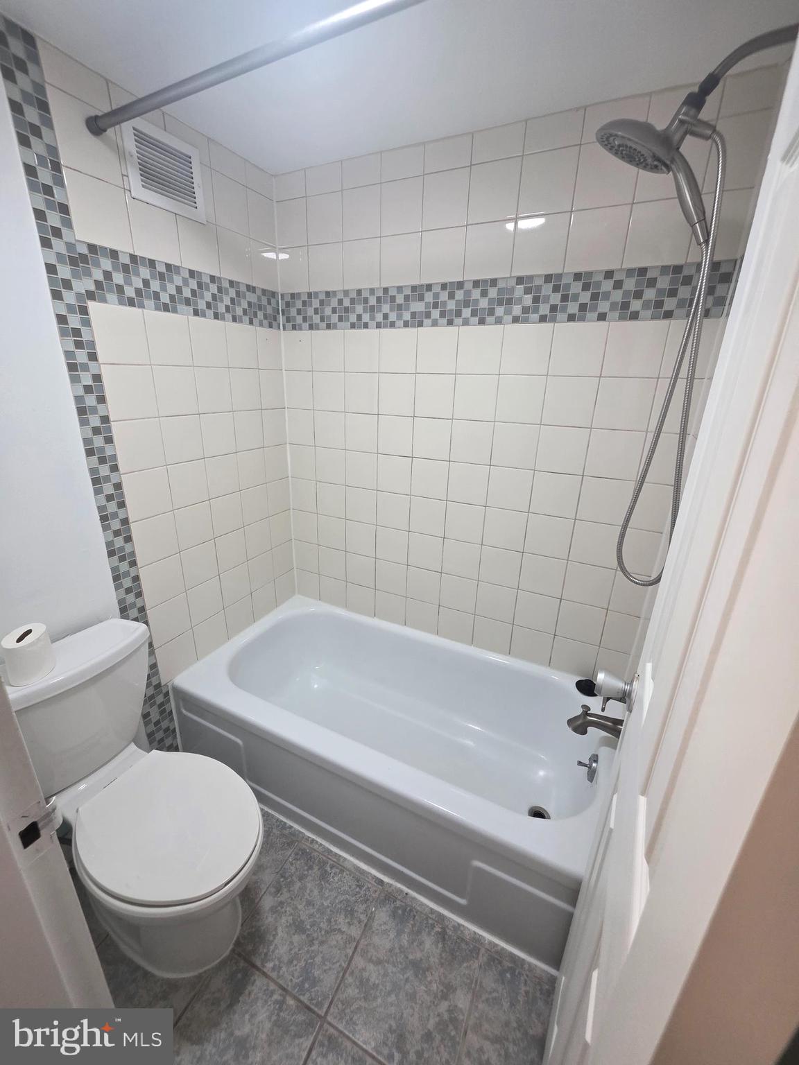 1836 Metzerott Road, Unit 1704 Adelphi, MD 20783 - Photo 42 of 47 a bathroom with a toilet and a shower