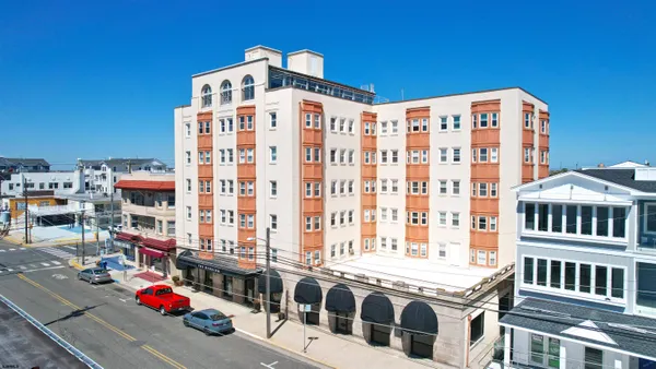 a view of a building with parking space