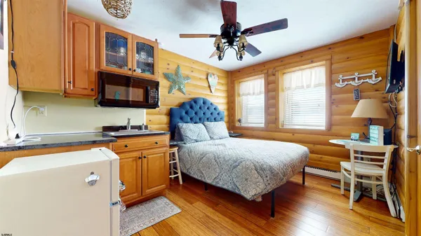 a bedroom with a bed and a chandelier