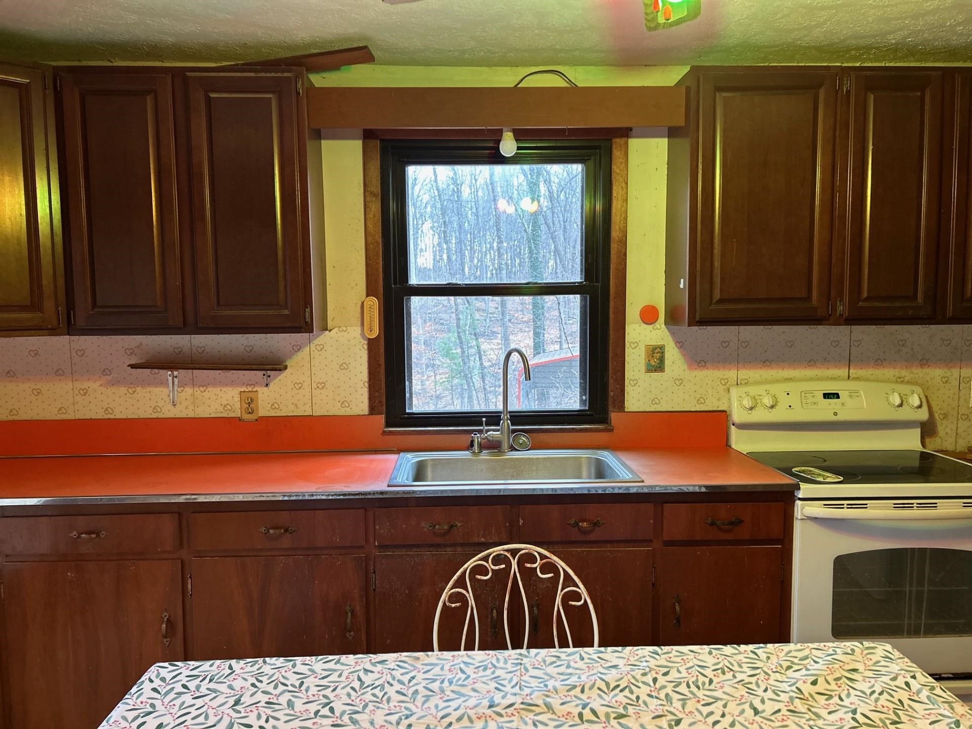 2219 Hewitt Road Swoope, VA 24479 - Photo 23 of 53 a kitchen with a cabinets and window