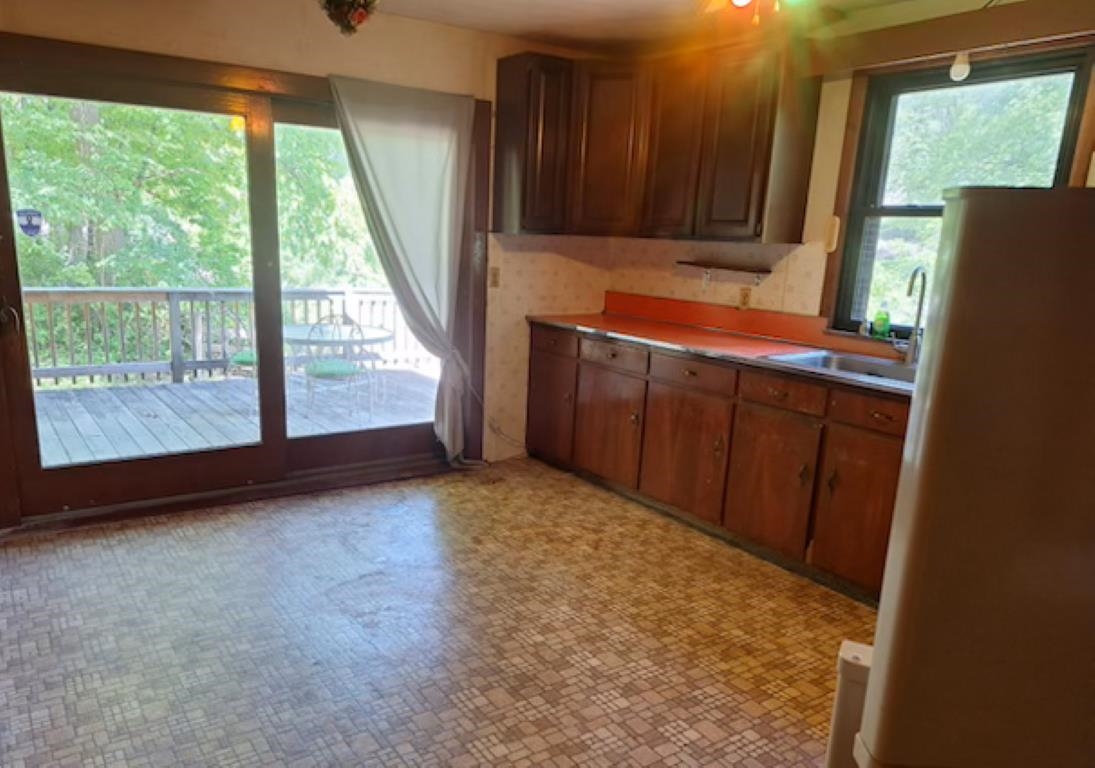 2219 Hewitt Road Swoope, VA 24479 - Photo 24 of 53 a view of a kitchen with wooden floor and a window