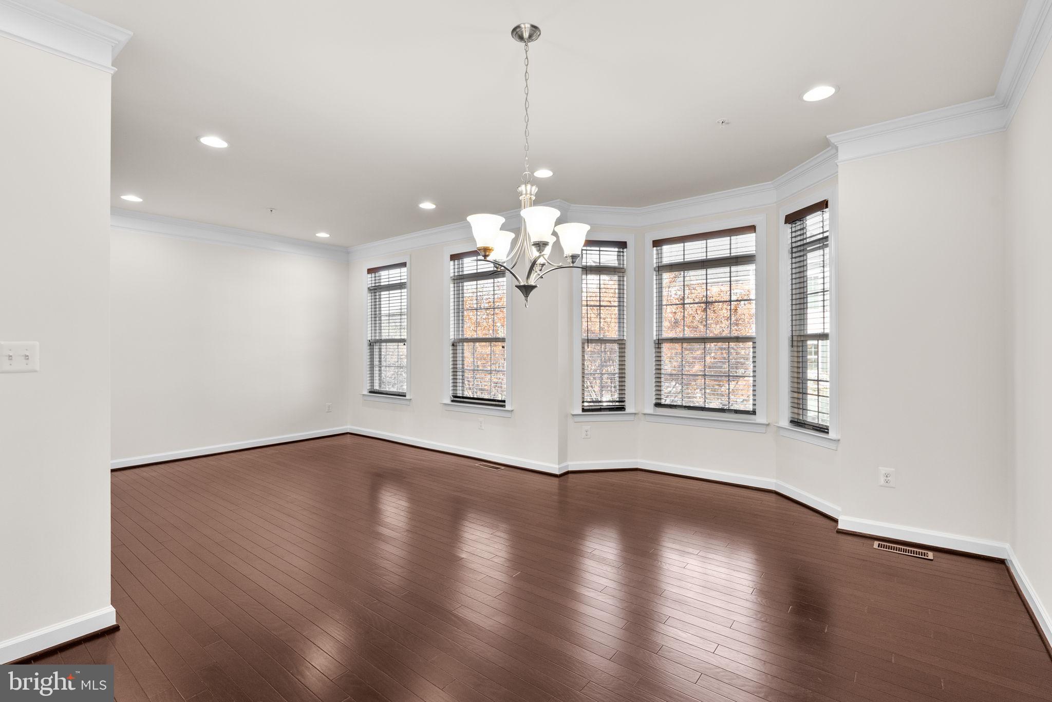 176 Autumn View Drive Gaithersburg, MD 20878 - Photo 12 of 45 a view of a room with wooden floor and windows