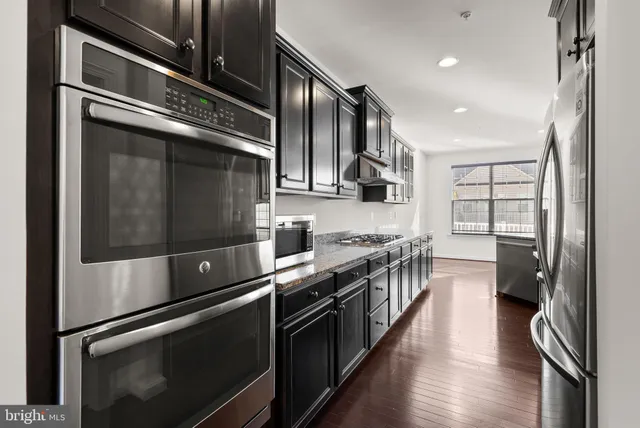 a kitchen with stainless steel appliances and sink