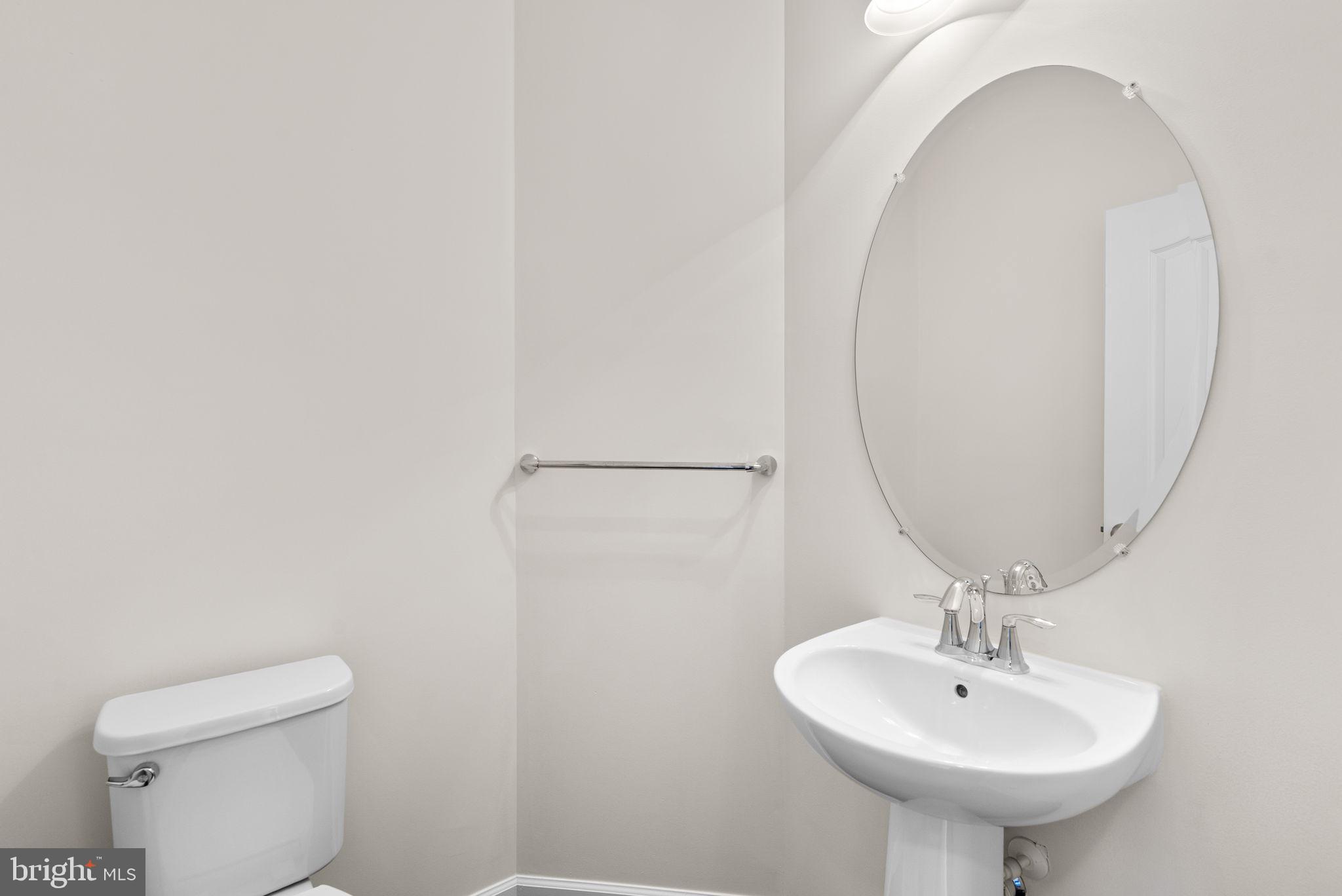 176 Autumn View Drive Gaithersburg, MD 20878 - Photo 25 of 45 a bathroom with a sink a mirror and a toilet