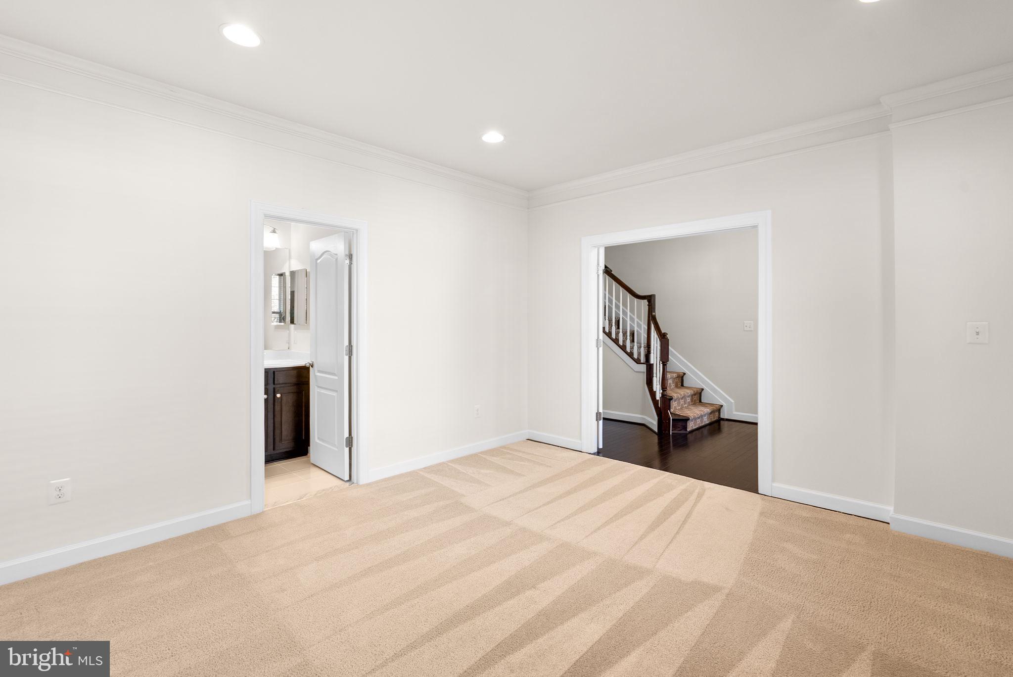 176 Autumn View Drive Gaithersburg, MD 20878 - Photo 40 of 45 a view of a livingroom with wooden floor and a staircase
