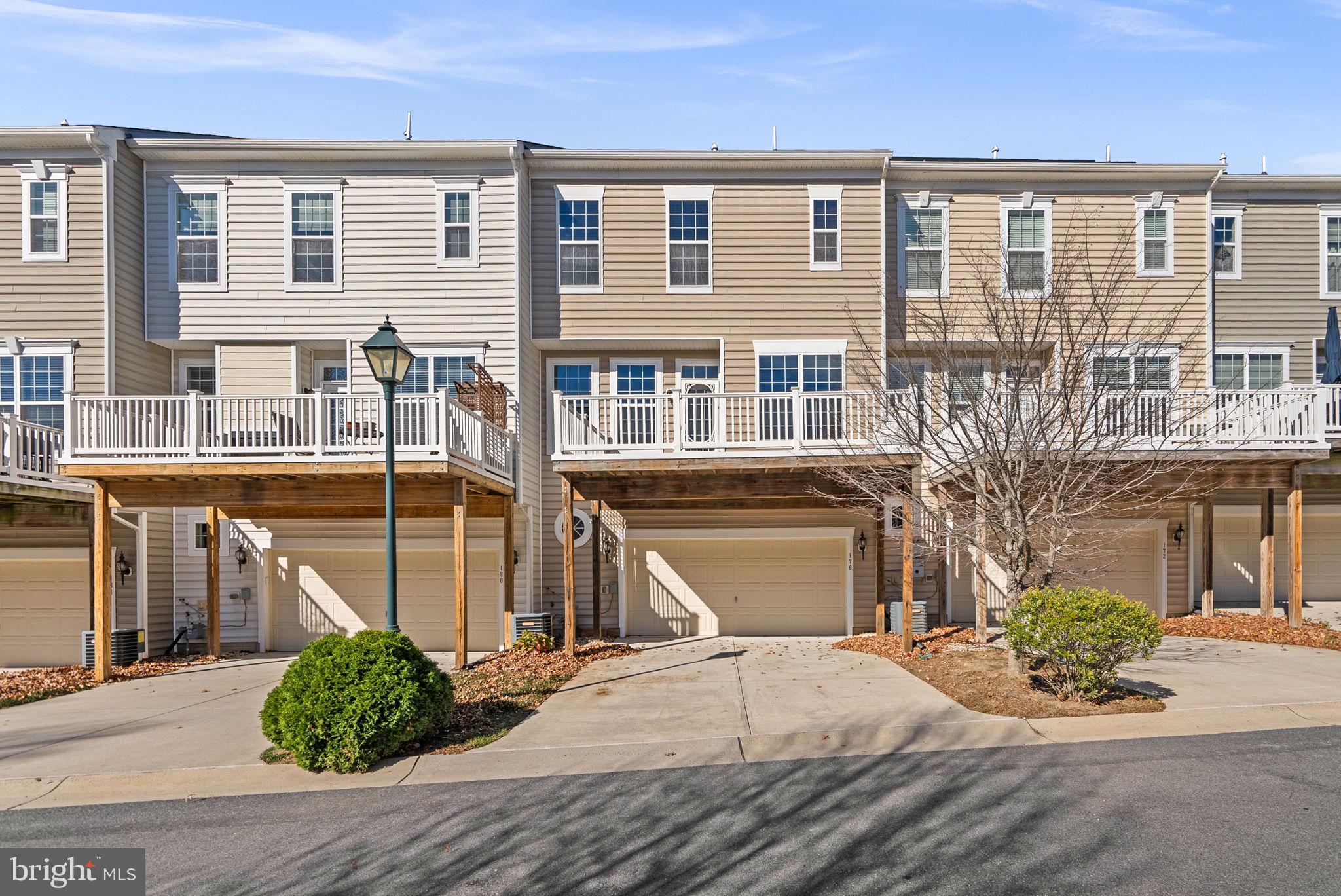 176 Autumn View Drive Gaithersburg, MD 20878 - Photo 44 of 45 a front view of a house with a yard
