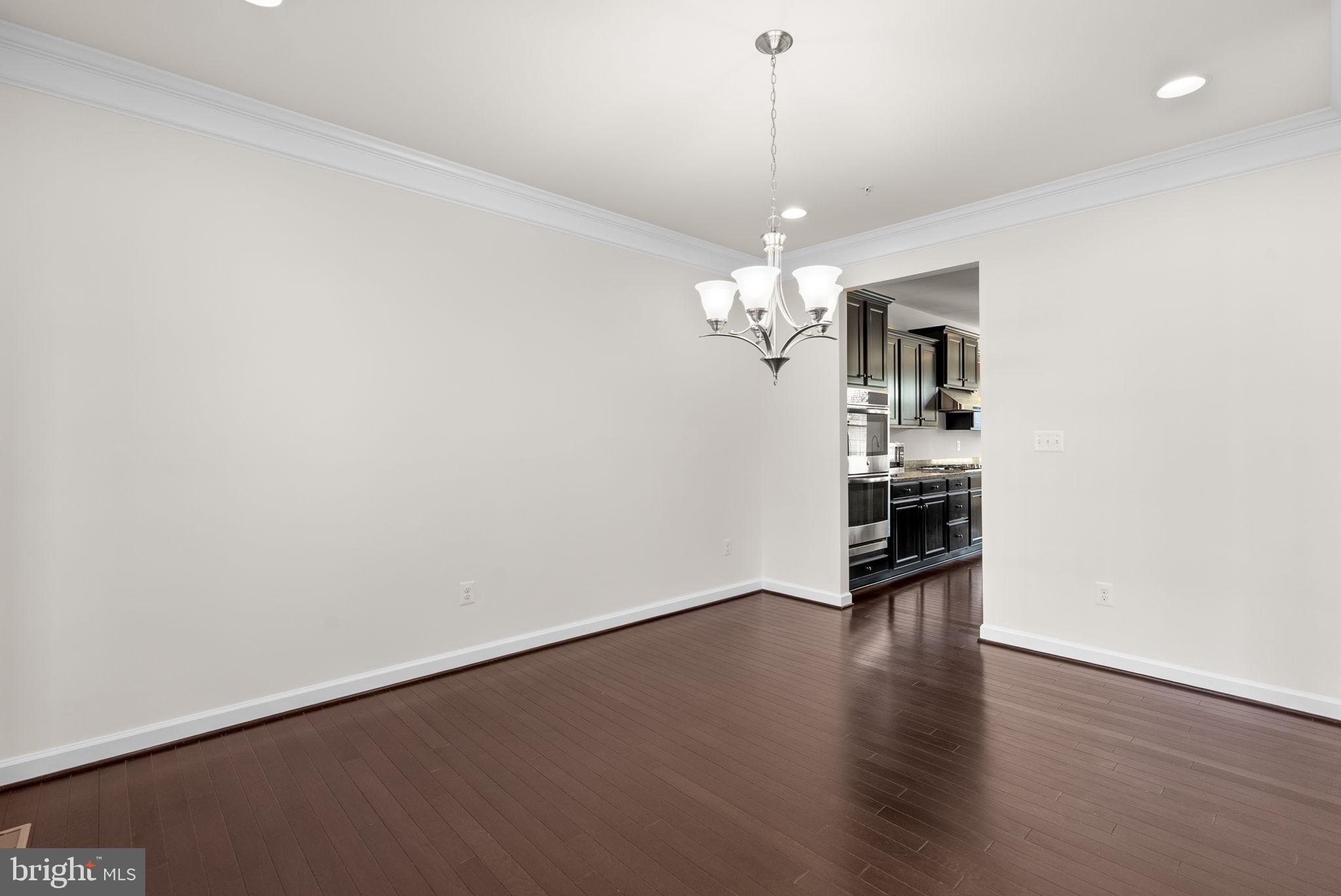 176 Autumn View Drive Gaithersburg, MD 20878 - Photo 10 of 45 a view of a livingroom with a stove wooden floor and a kitchen
