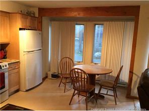 820 Columbine Road, Unit 2 Breckenridge, CO 80424 - Photo 4 of 7 a view of a dining room with furniture and a window