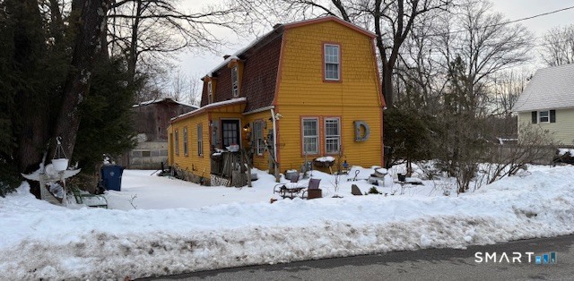 5 Charles Street Windham, CT 06226 - Photo 3 of 6 a view of a house with a yard covered in snow