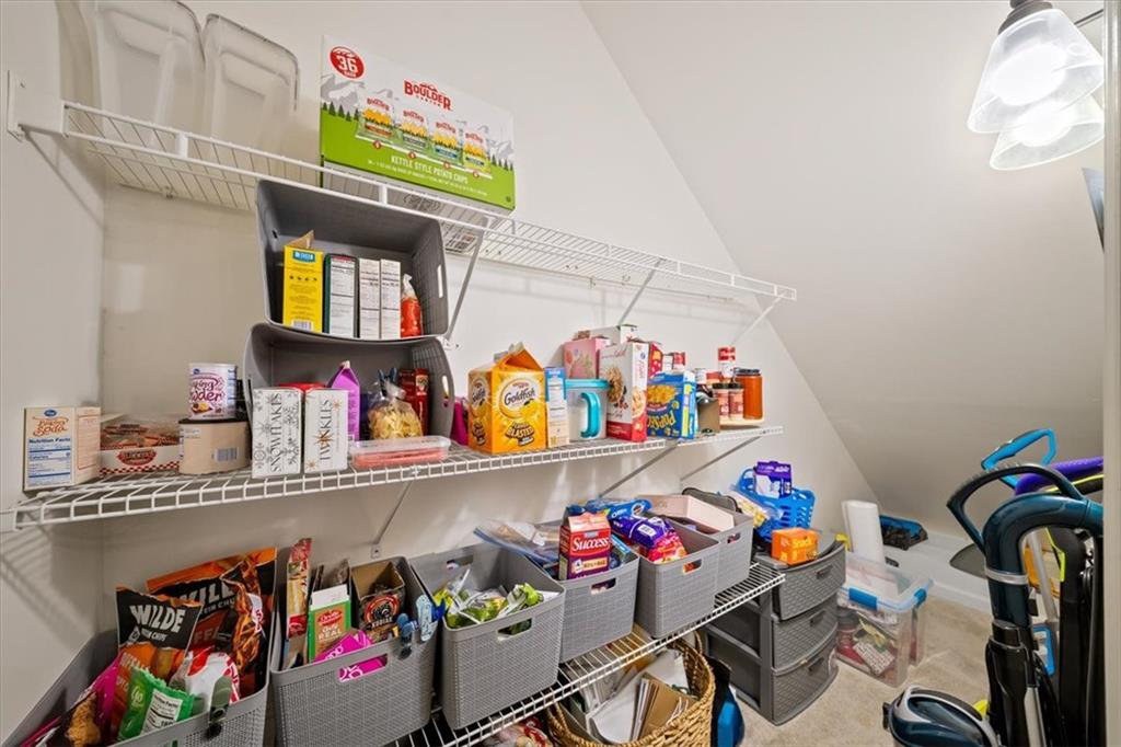 429 Farmwood Way Canton, GA 30115 - Photo 15 of 56 a utility room with lots of clutter and toys
