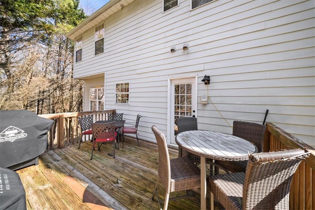 429 Farmwood Way Canton, GA 30115 - Photo 23 of 56 a backyard of a house with table and chairs