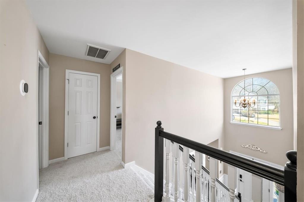 429 Farmwood Way Canton, GA 30115 - Photo 26 of 56 a view of a hallway with windows