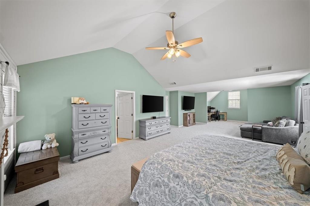 429 Farmwood Way Canton, GA 30115 - Photo 28 of 56 a bedroom with a large bed and a tv