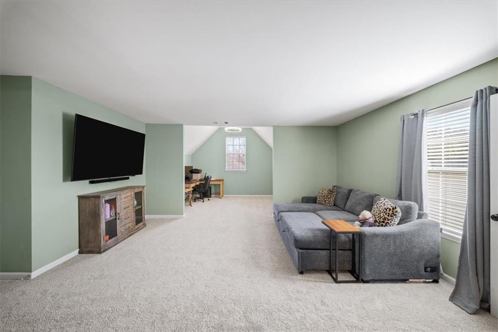 429 Farmwood Way Canton, GA 30115 - Photo 29 of 56 a living room with furniture and a flat screen tv