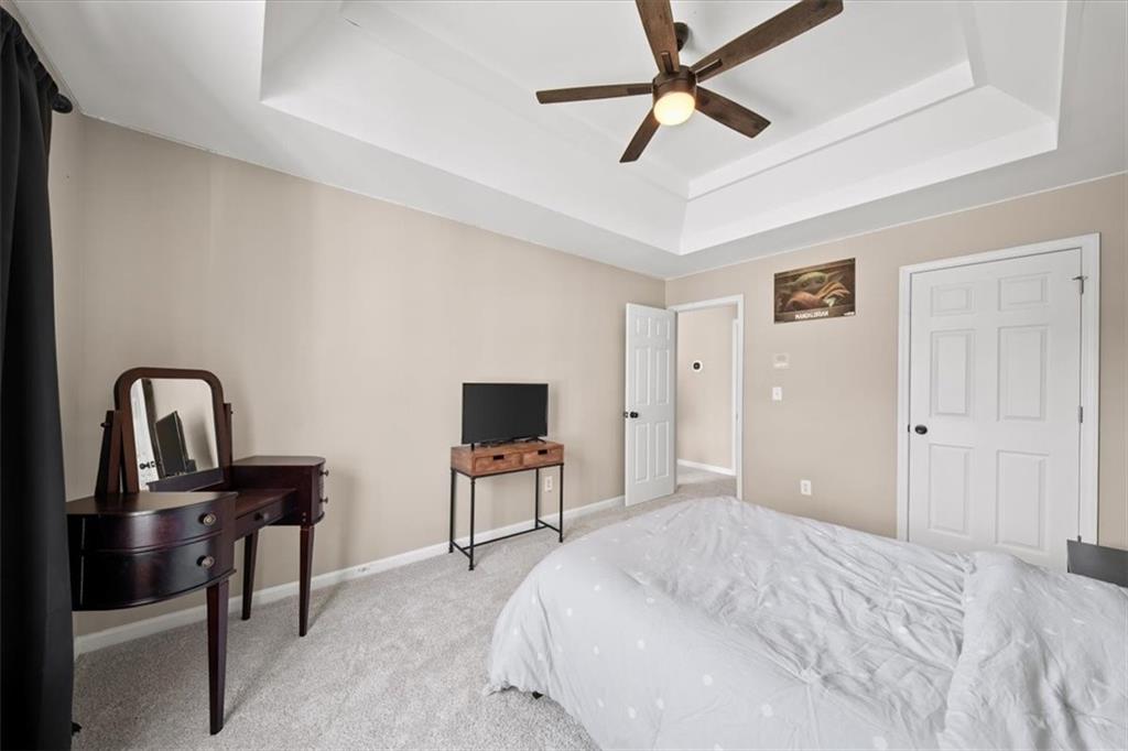 429 Farmwood Way Canton, GA 30115 - Photo 38 of 56 a bedroom with a bed and a television