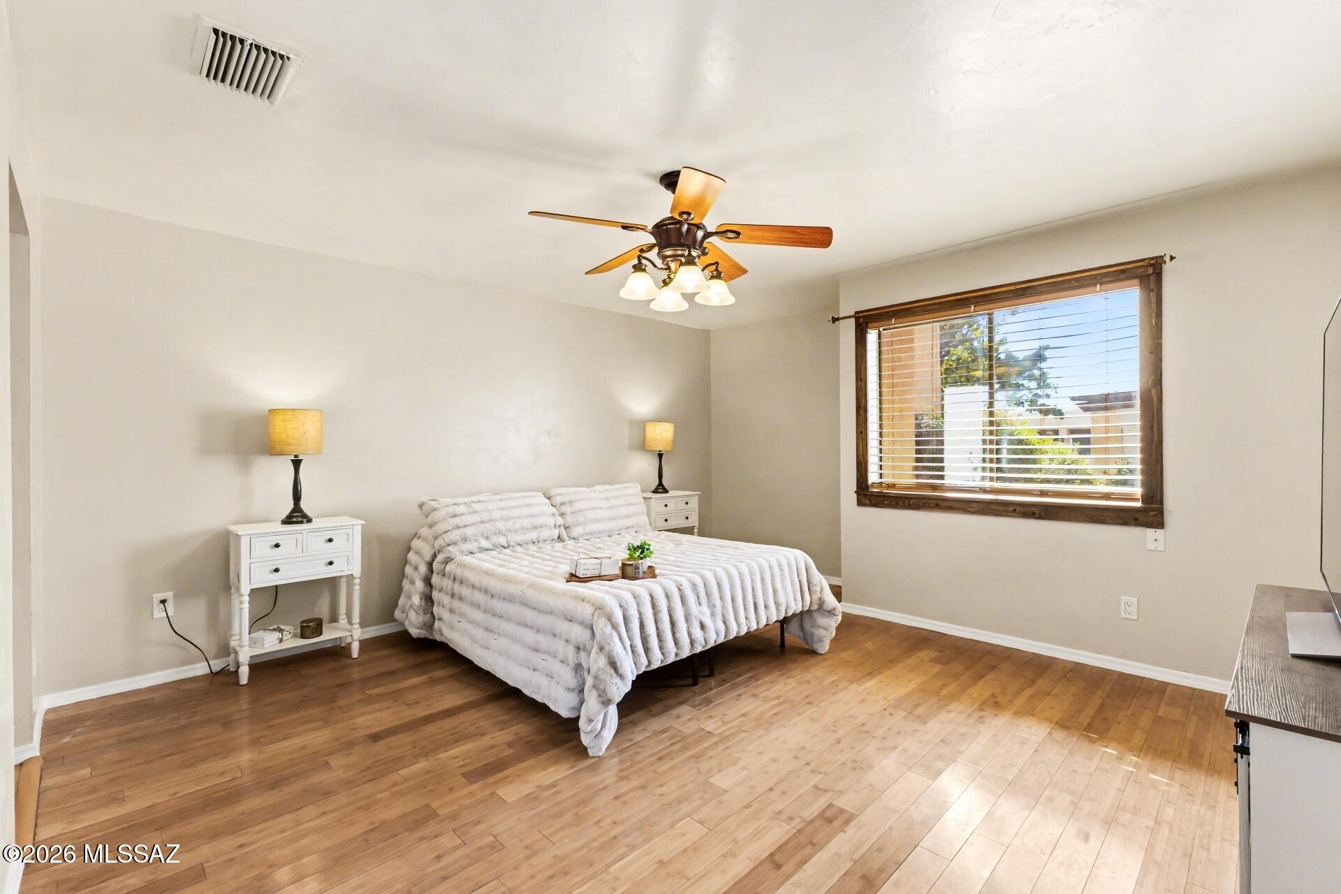 3781 East Edison Street Tucson, AZ 85716 - Photo 16 of 28 a bedroom with a bed and a window
