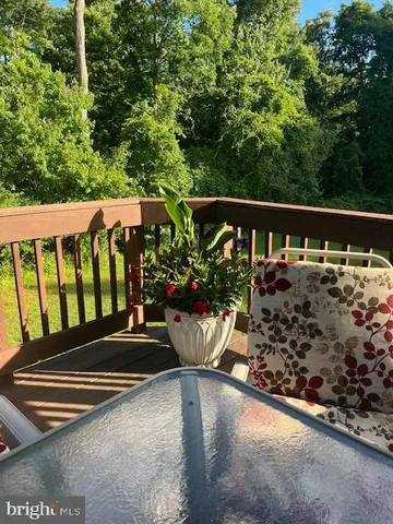 a view of a wooden fence with chairs
