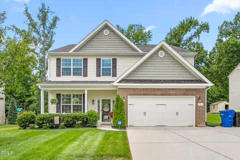 front view of a house with a yard