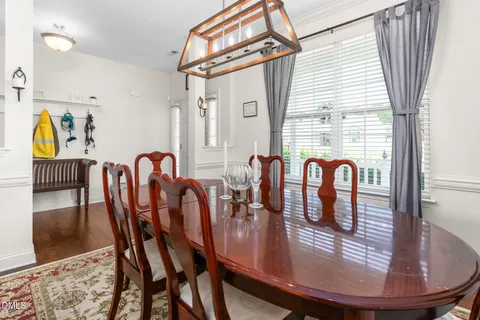 front view of a house with potted plants