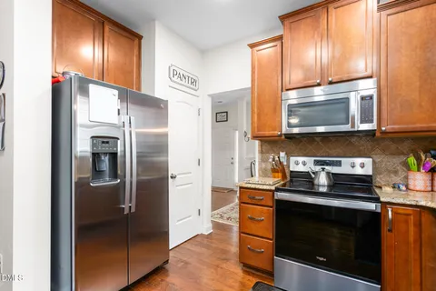 a kitchen with a sink cabinets and window
