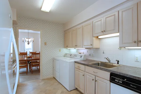 a kitchen with a sink and cabinets
