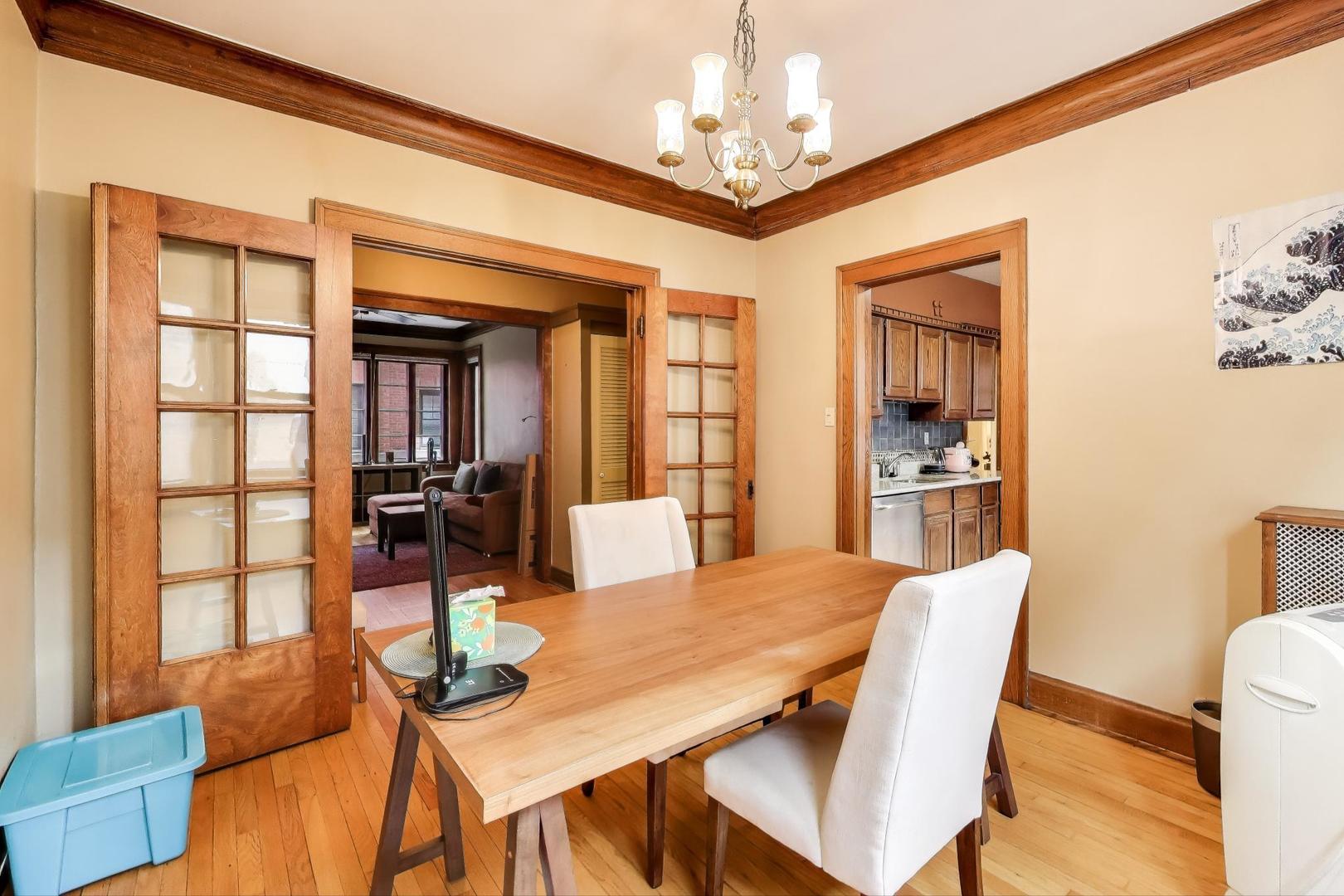 2016 Sherman Avenue, Unit 1E Evanston, IL 60201 - Photo 11 of 25 a view of a dining room with furniture
