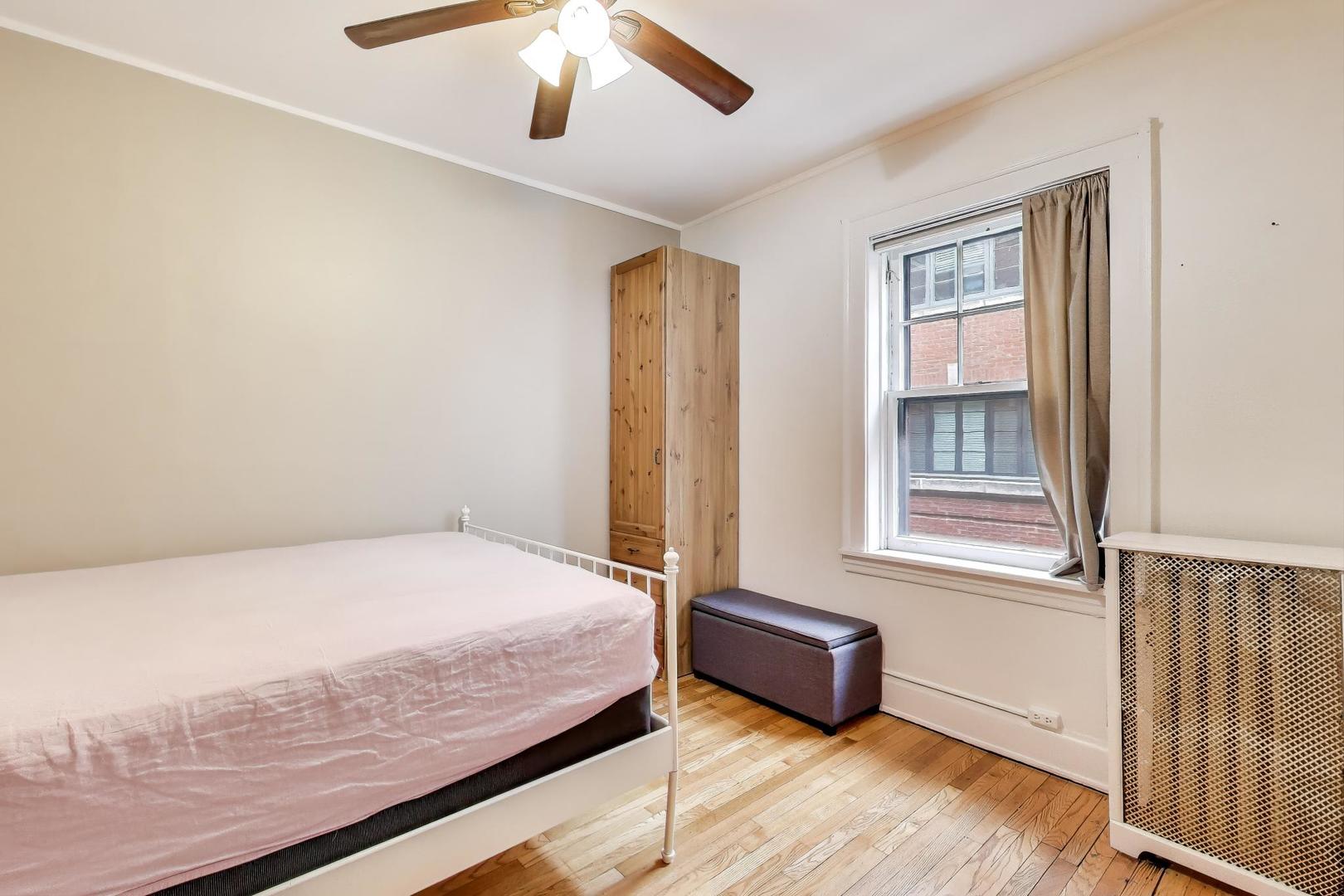 2016 Sherman Avenue, Unit 1E Evanston, IL 60201 - Photo 17 of 25 a bedroom with a bed and a window