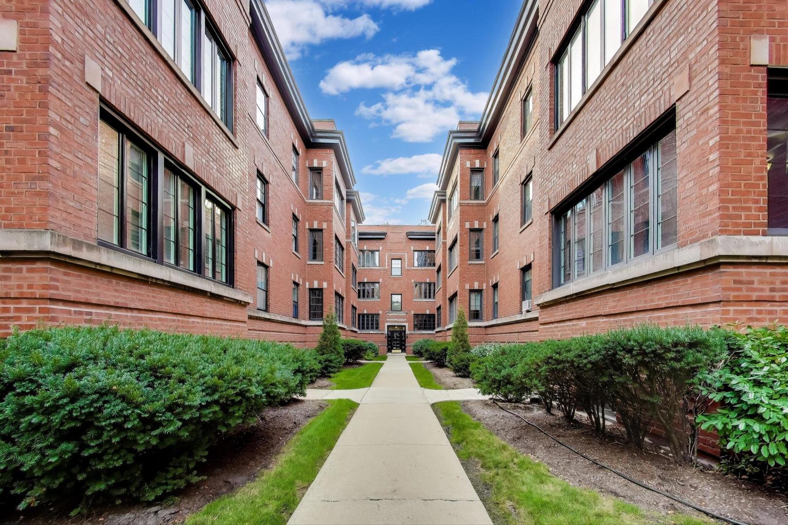 2016 Sherman Avenue, Unit 1E Evanston, IL 60201 - Photo 2 of 25 a view of a building with brick walls