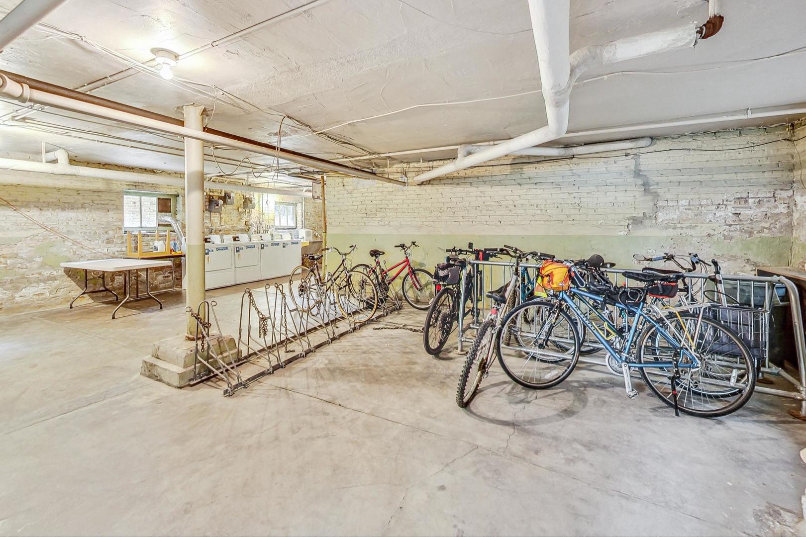 2016 Sherman Avenue, Unit 1E Evanston, IL 60201 - Photo 21 of 25 walk in a room with bicycles a table and chairs