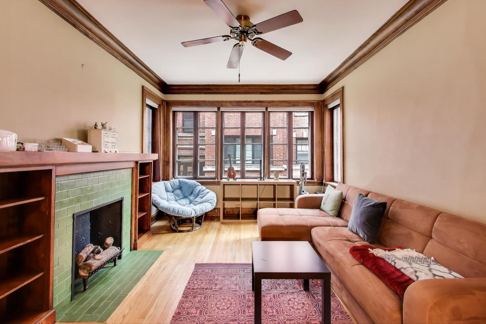 2016 Sherman Avenue, Unit 1E Evanston, IL 60201 - Photo 7 of 25 a living room with furniture fireplace and a large window