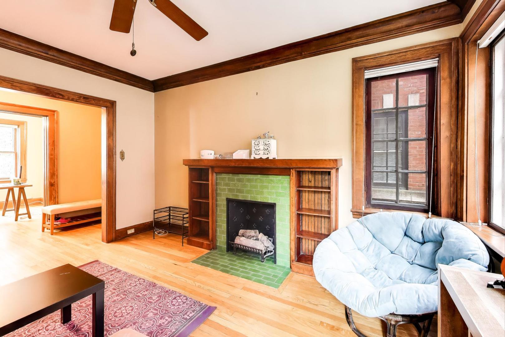 2016 Sherman Avenue, Unit 1E Evanston, IL 60201 - Photo 9 of 25 a living room with furniture and a fireplace