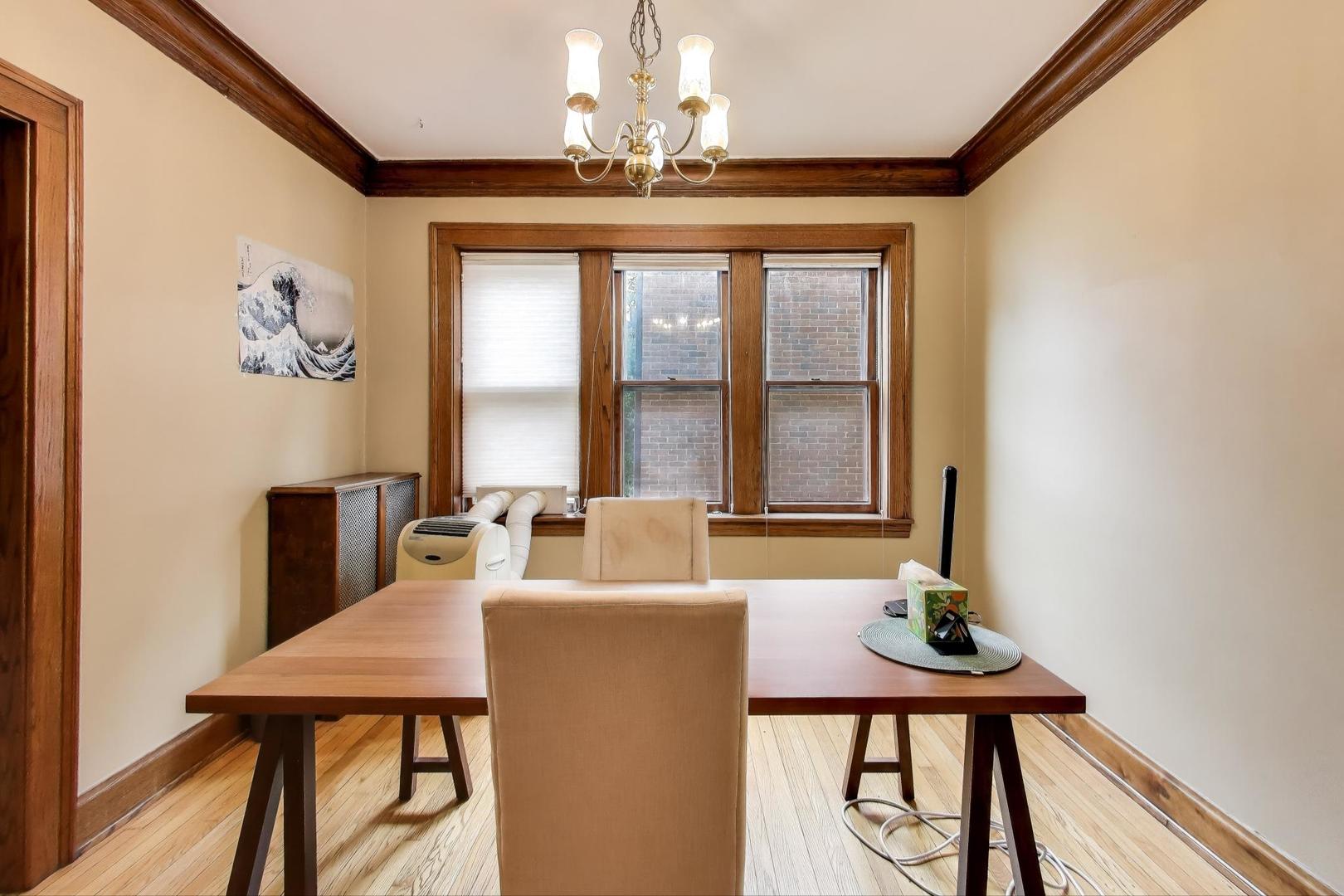 2016 Sherman Avenue, Unit 1E Evanston, IL 60201 - Photo 10 of 25 a view of a dining room with furniture and window