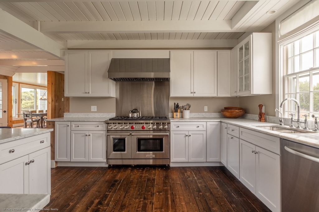 21 Quidnet Road, Unit 1 Nantucket, MA 02554 - Photo 12 of 42 a kitchen with a stove oven and sink