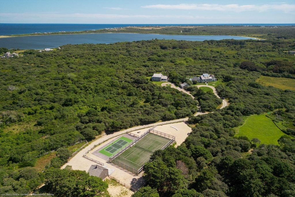 21 Quidnet Road, Unit 1 Nantucket, MA 02554 - Photo 2 of 42 a view of a field with an ocean