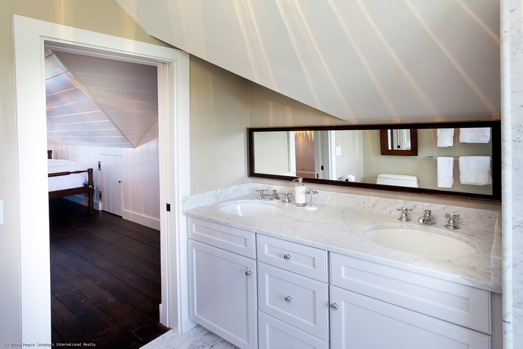 21 Quidnet Road, Unit 1 Nantucket, MA 02554 - Photo 34 of 42 a bathroom with a sink and a mirror
