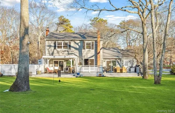 a front view of building with yard and green space