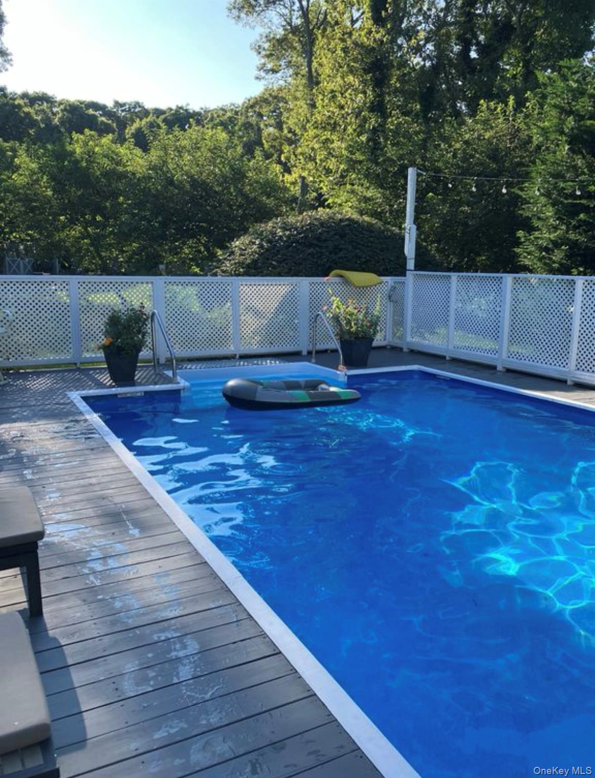 23 North Westbury Road Hampton Bays, NY 11946 - Photo 4 of 19 a view of outdoor space and deck