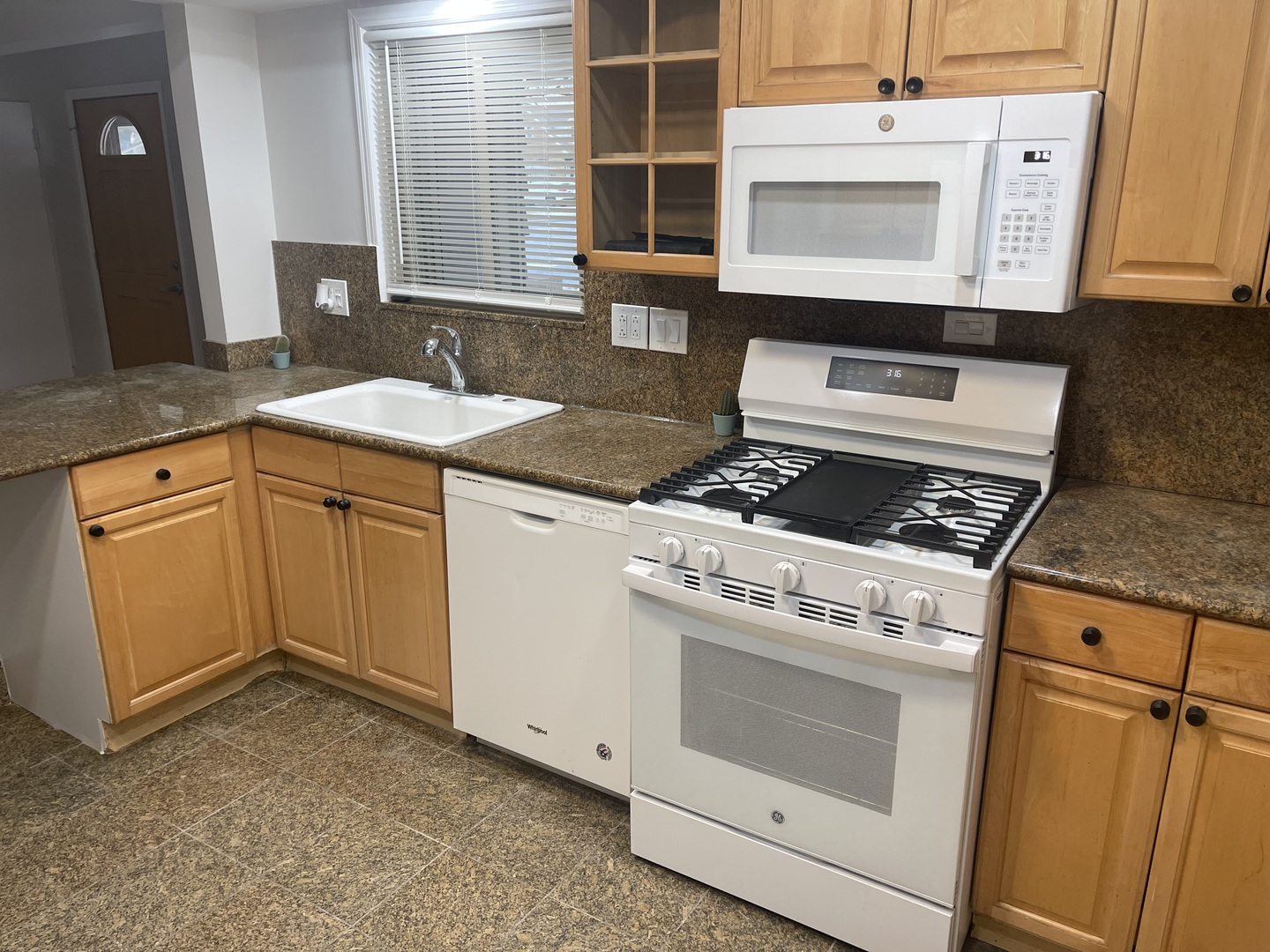 1720 South Cumberland Avenue Park Ridge, IL 60068 - Photo 12 of 26 a kitchen with granite countertop cabinets stainless steel appliances and a sink